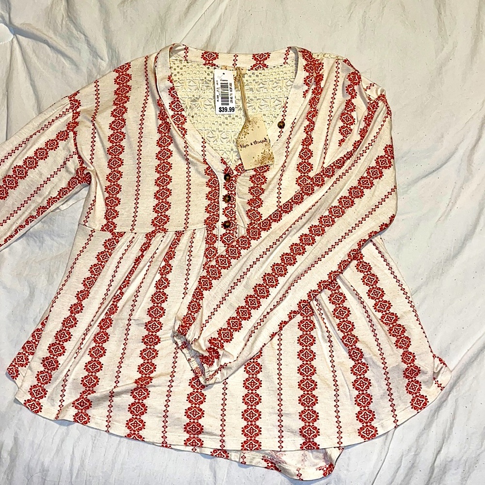 Brand new! Red and cream colored long sleeve!